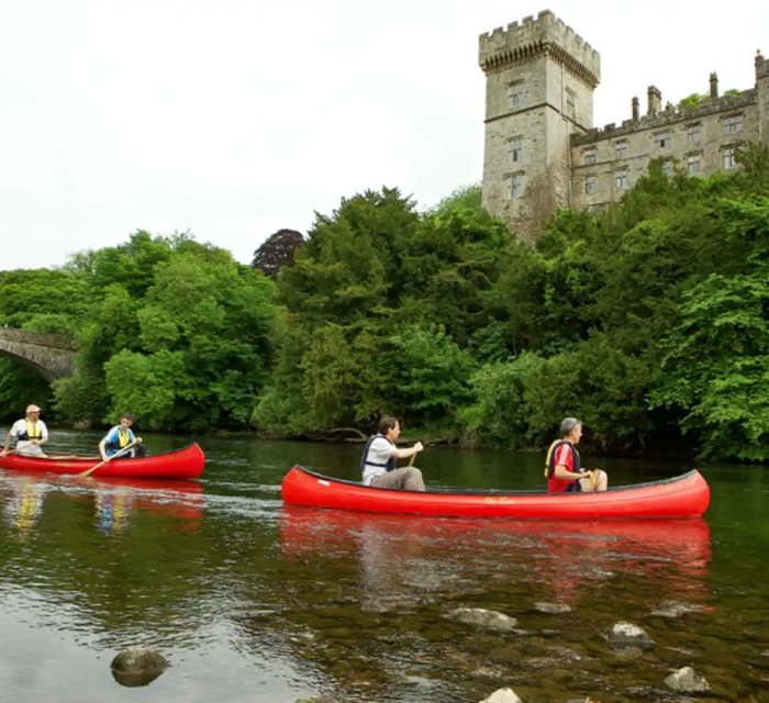 Two canoes on the river below Lismore Castle